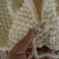 sewing knitted parts together